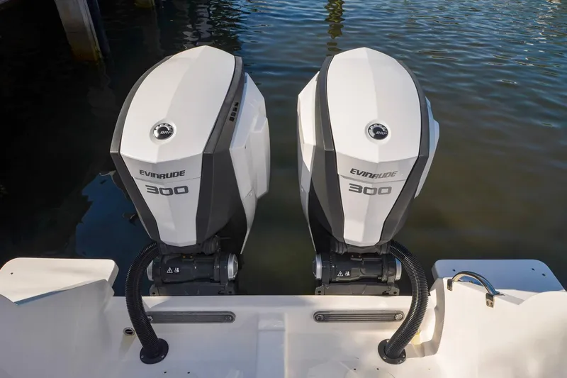 Quid Pro Quo Yacht Photos Pics Twin Evinrude 300 engines on a 2013 Intrepid 300 Center Console boat.