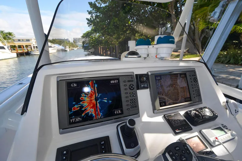 Quid Pro Quo Yacht Photos Pics 2013 Intrepid 300 Center Console dashboard with navigation screens and controls.