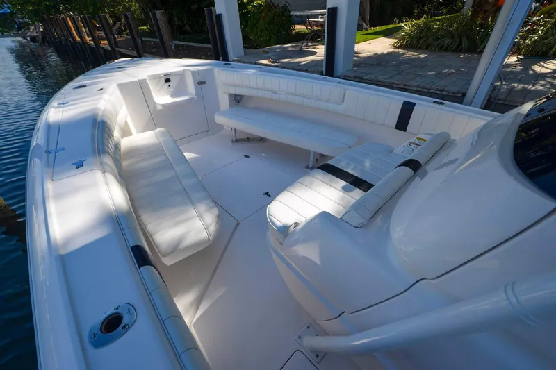 Quid Pro Quo Yacht Photos Pics 2013 Intrepid 300 Center Console boat interior with white seating and spacious deck.