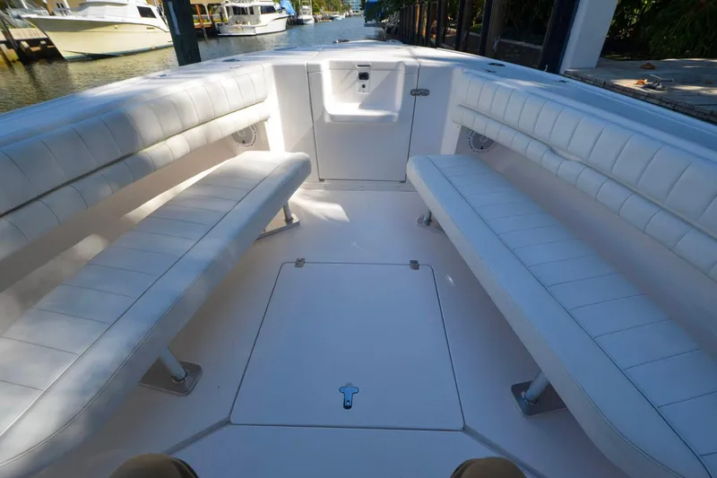 Quid Pro Quo Yacht Photos Pics 2013 Intrepid 300 Center Console boat interior with white cushioned seating.