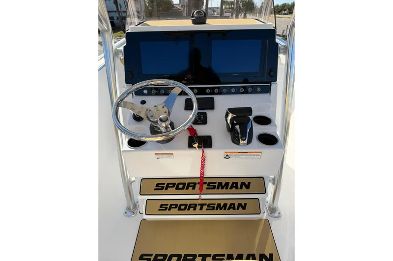  Yacht Photos Pics 2023 Sportsman Heritage 241 Center Console dashboard with steering wheel and controls.
