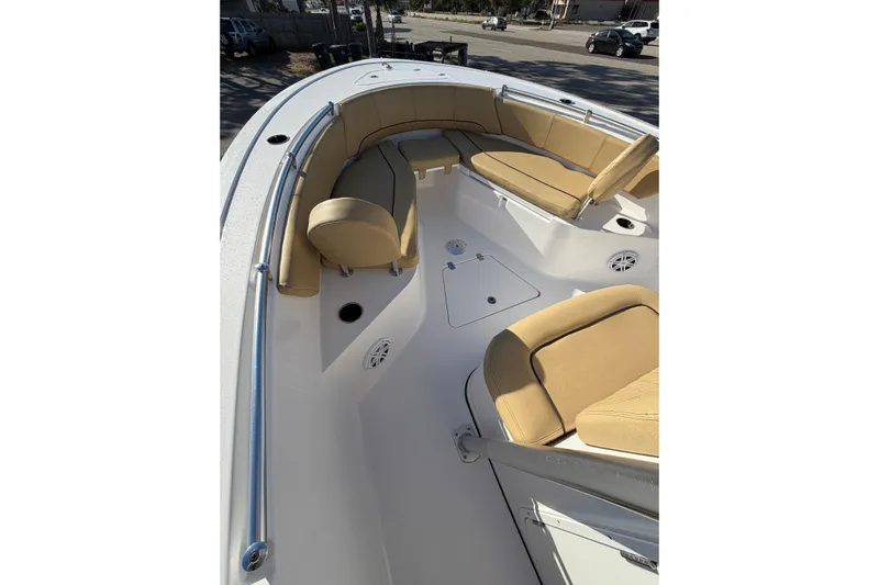  Yacht Photos Pics 2023 Sportsman Heritage 241 Center Console boat interior with tan seating and stainless steel railings.