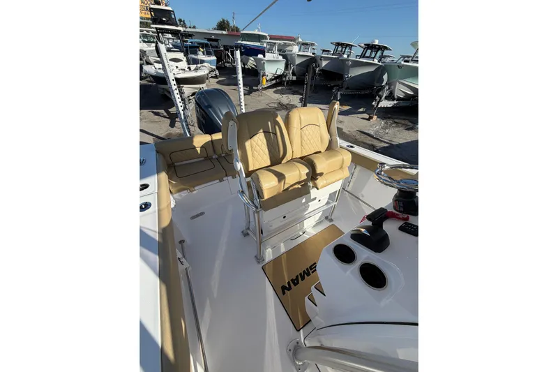  Yacht Photos Pics 2023 Sportsman Heritage 241 Center Console boat interior with tan seating and control panel.