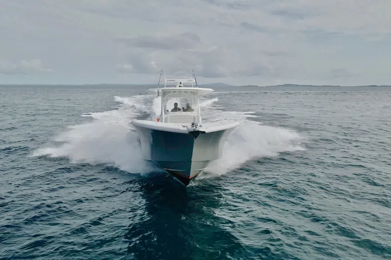 Backstage Yacht Photos Pics 2015 Yellowfin 42 Offshore boat cruising on open water.