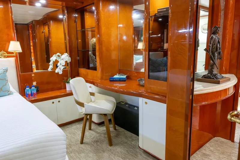 Kaya Yacht Photos Pics Luxurious interior of 2003 Johnson 87' Motor Yacht with elegant wood finishes and decor.
