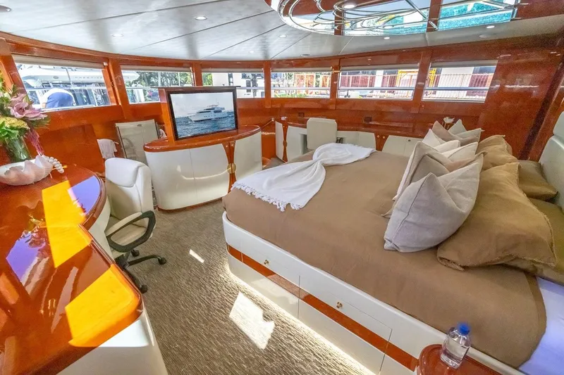 Kaya Yacht Photos Pics Luxurious interior of 2003 Johnson 87' Motor Yacht with elegant furnishings and large windows.