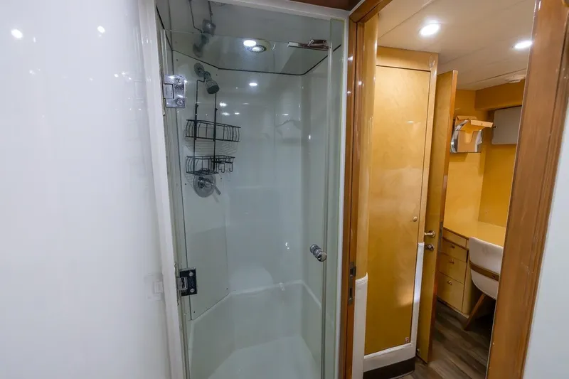 Kaya Yacht Photos Pics Luxurious bathroom interior on 2003 Johnson 87' Motor Yacht, featuring a modern shower.