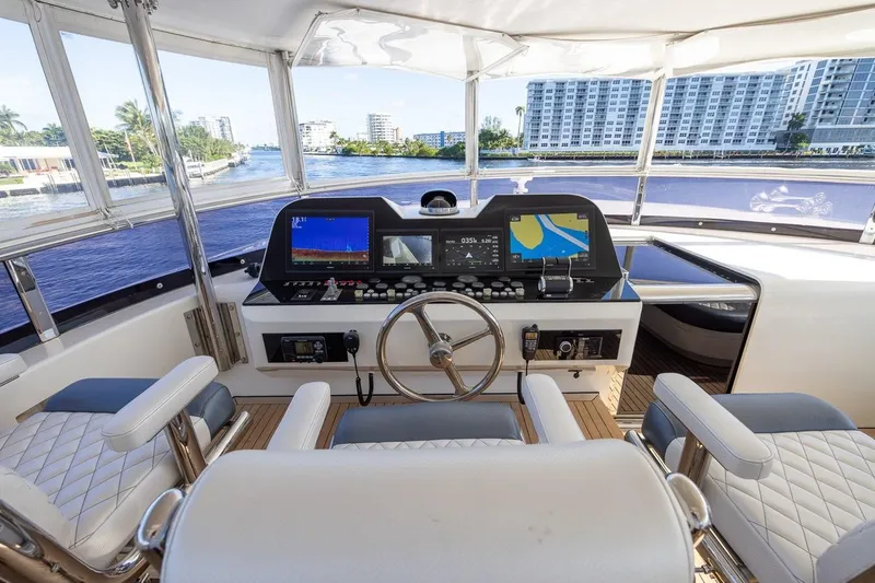 Kaya Yacht Photos Pics Luxurious helm of 2003 Johnson 87' Motor Yacht with modern navigation equipment.