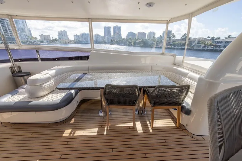 Kaya Yacht Photos Pics Luxurious 2003 Johnson 87' Motor Yacht interior with elegant seating and waterfront view.
