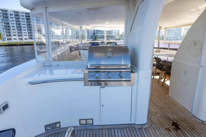 Kaya Yacht Photos Pics Outdoor grill on 2003 Johnson 87' Motor Yacht deck with waterfront view.