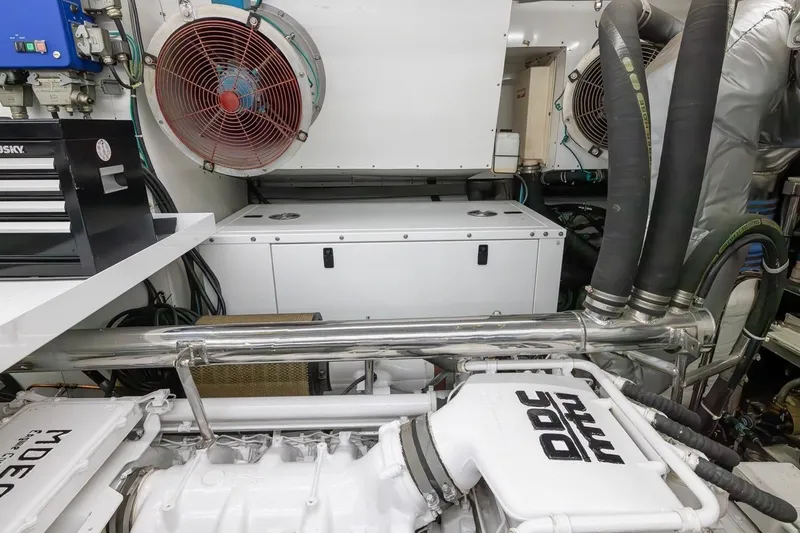 Kaya Yacht Photos Pics Engine room of 2003 Johnson 87' Motor Yacht with visible machinery and ventilation system.