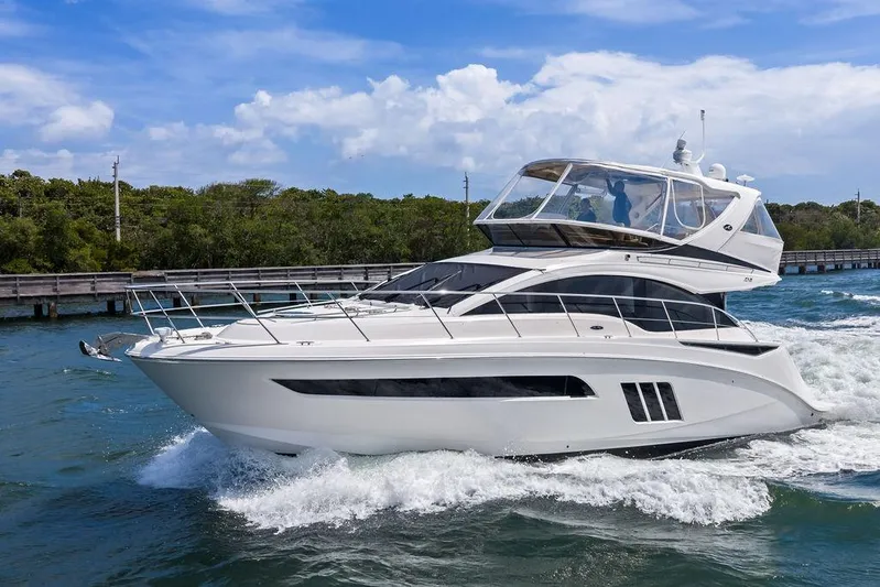 Ern'd It Yacht Photos Pics 2017 Sea Ray Fly 510 yacht cruising on a sunny day.