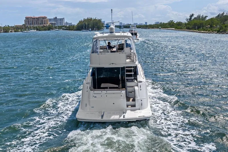 Ern'd It Yacht Photos Pics 2017 Sea Ray Fly 510 yacht cruising on a scenic waterway.
