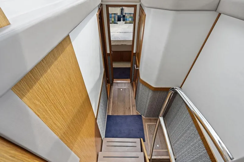 Ern'd It Yacht Photos Pics Stairway inside 2017 Sea Ray Fly 510 yacht, featuring modern wood and metal design.