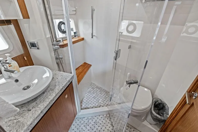 Ern'd It Yacht Photos Pics Luxurious bathroom on 2017 Sea Ray Fly 510 yacht with modern fixtures and glass shower.