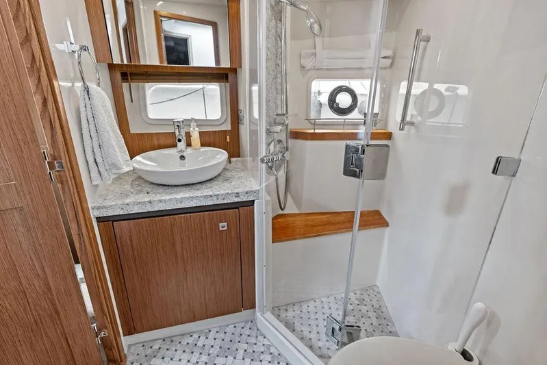Ern'd It Yacht Photos Pics Luxurious bathroom in 2017 Sea Ray Fly 510 yacht with modern fixtures and elegant design.