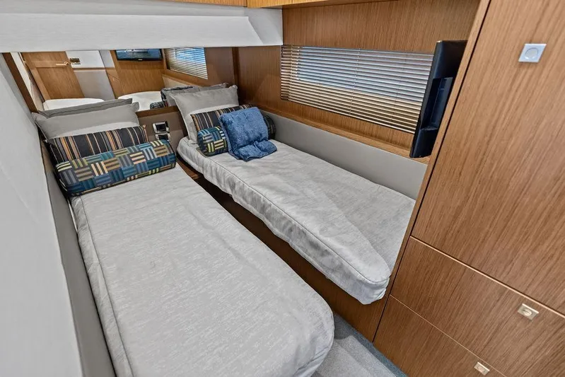 Ern'd It Yacht Photos Pics Luxurious twin cabin interior of 2017 Sea Ray Fly 510 yacht with modern decor.