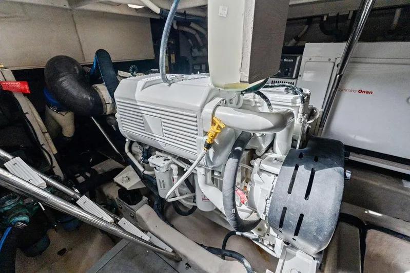 Ern'd It Yacht Photos Pics Engine room of 2017 Sea Ray Fly 510 yacht, featuring Cummins Onan generator.