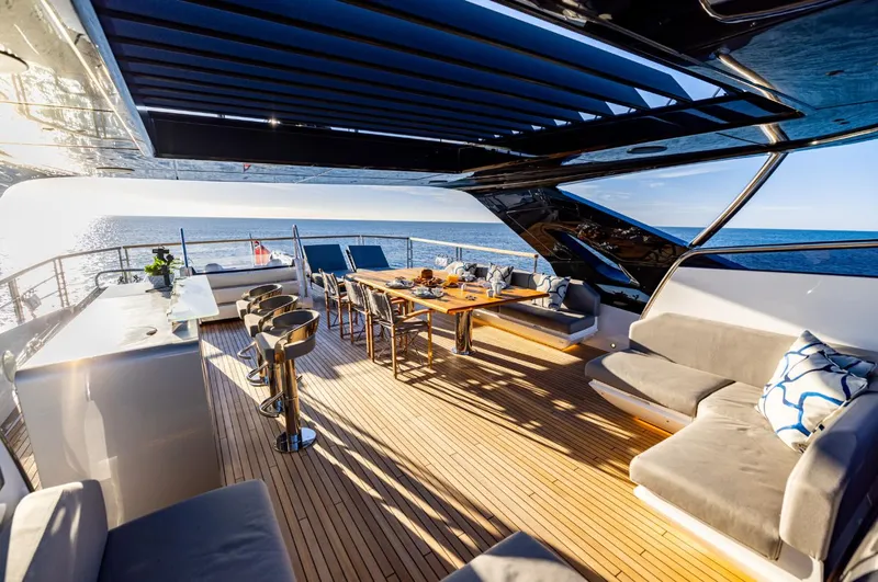  Yacht Photos Pics Luxurious Sunseeker 100 Yacht 2025 with spacious deck, elegant seating, and ocean view.