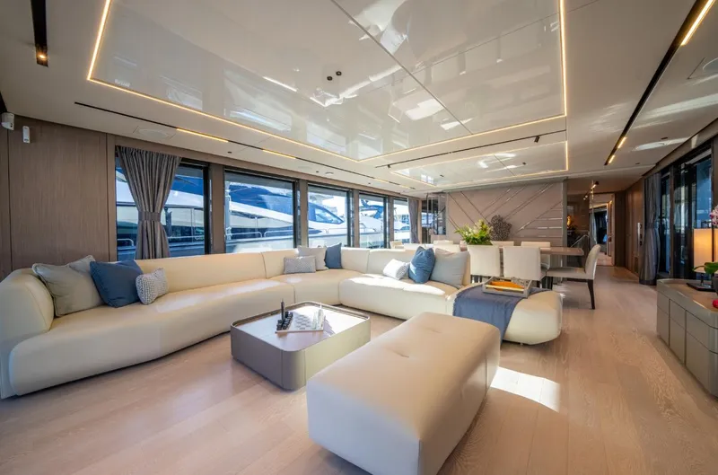  Yacht Photos Pics Luxurious interior of 2025 Sunseeker 100 Yacht with modern furnishings and panoramic windows.