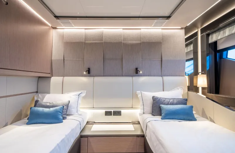  Yacht Photos Pics Luxurious twin bedroom in 2025 Sunseeker 100 Yacht, featuring modern design and elegant lighting.