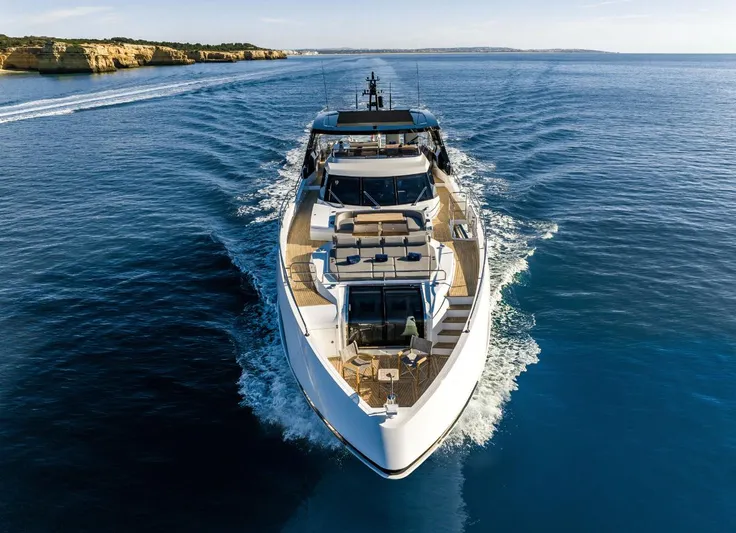  Yacht Photos Pics 2025 Sunseeker 100 Yacht cruising on open water, showcasing luxury and sleek design.