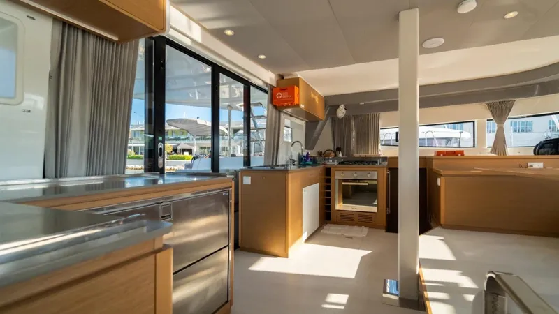  Yacht Photos Pics Luxurious interior of 2023 Excess 15 yacht with modern kitchen and large windows.