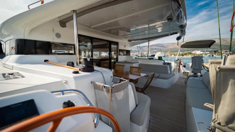  Yacht Photos Pics Luxurious 2023 Excess 15 yacht with spacious deck and modern seating area.