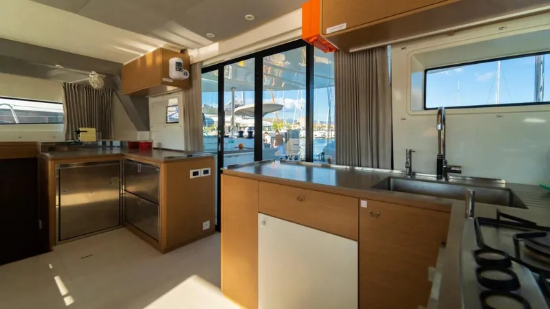  Yacht Photos Pics Modern kitchen interior on 2023 Excess 15 yacht, featuring sleek design and ample natural light.