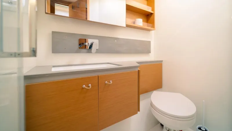  Yacht Photos Pics Modern bathroom in 2023 Excess 15 yacht with wooden cabinets and sleek design.