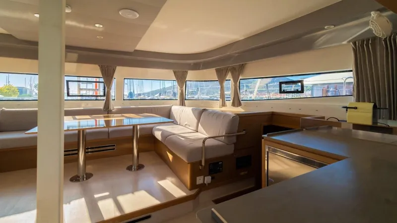  Yacht Photos Pics Luxurious interior of 2023 Excess 15 catamaran with spacious seating and dining area.