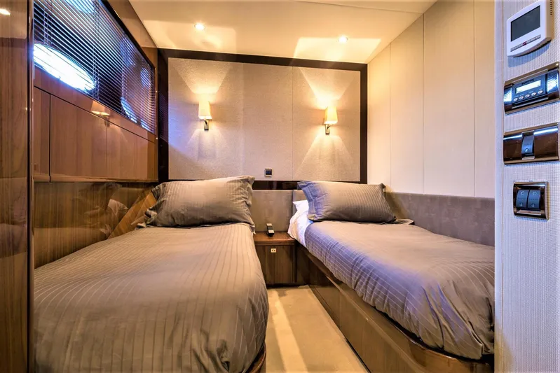  Yacht Photos Pics Luxurious twin bedroom in 2012 Princess 85 Motor Yacht, featuring elegant lighting and modern design.