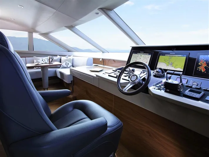  Yacht Photos Pics Luxurious helm of 2012 Princess 85 Motor Yacht with modern navigation equipment and seating.