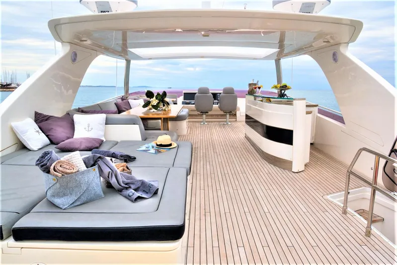  Yacht Photos Pics Luxurious 2012 Princess 85 Motor Yacht deck with seating, table, and ocean view.
