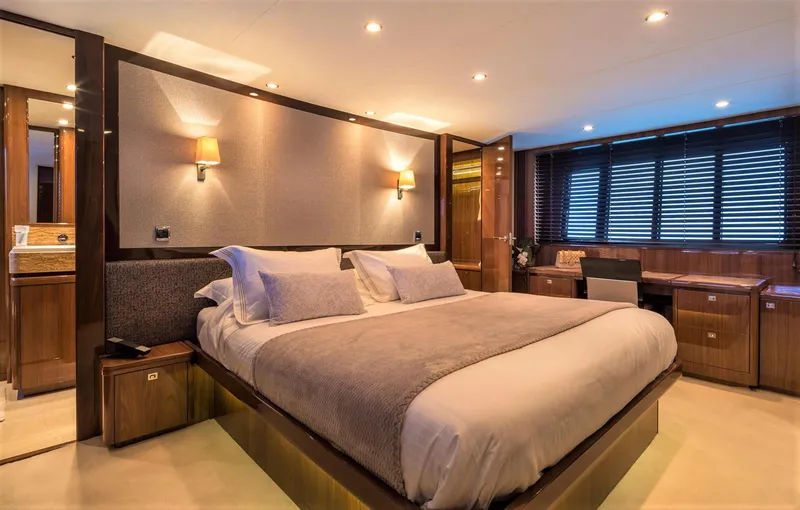  Yacht Photos Pics Luxurious bedroom interior on 2012 Princess 85 Motor Yacht with elegant lighting and wood finishes.