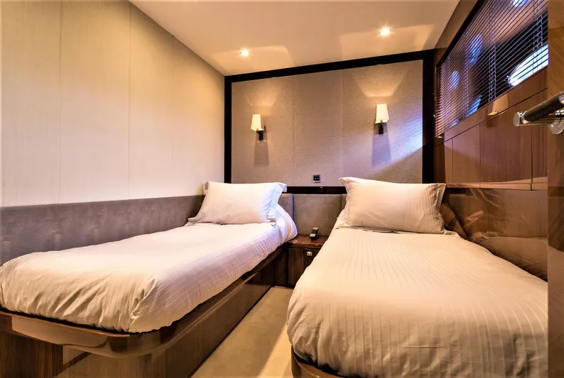  Yacht Photos Pics Luxurious twin bedroom in 2012 Princess 85 Motor Yacht, featuring elegant lighting and modern decor.