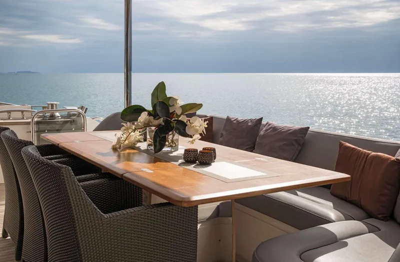  Yacht Photos Pics Luxurious 2012 Princess 85 Motor Yacht deck with elegant dining setup and ocean view.