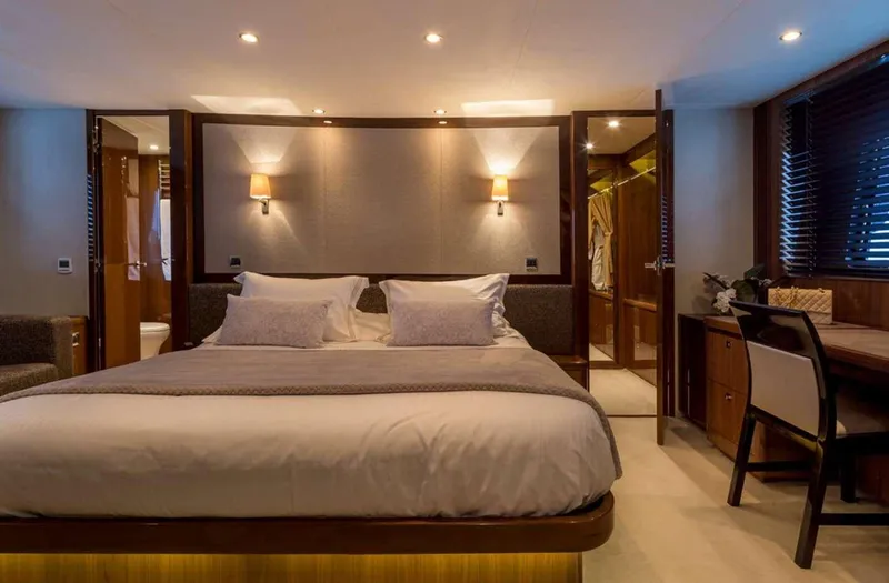  Yacht Photos Pics Luxurious bedroom interior of 2012 Princess 85 Motor Yacht with elegant lighting and furnishings.