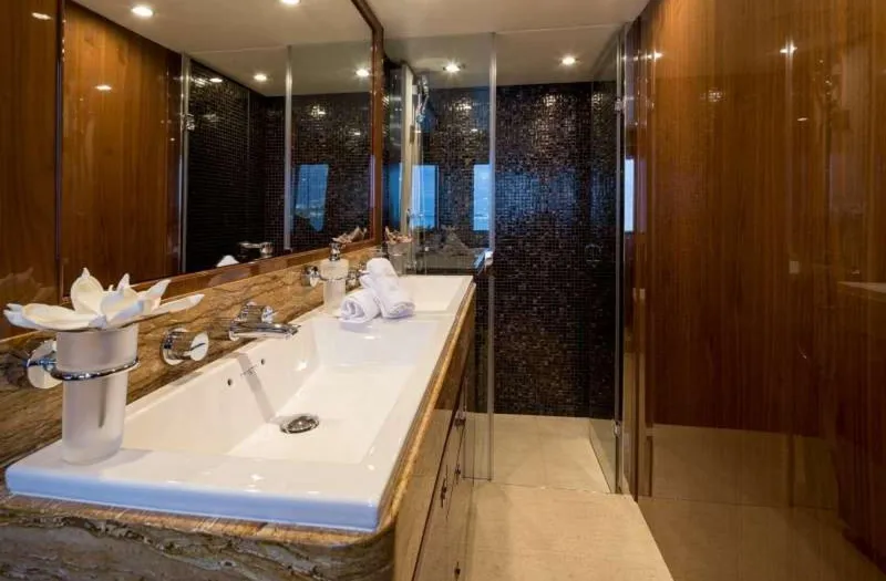  Yacht Photos Pics Luxurious bathroom on 2012 Princess 85 Motor Yacht with elegant fixtures and wood paneling.