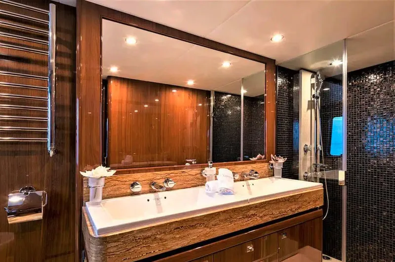  Yacht Photos Pics Luxurious bathroom on 2012 Princess 85 Motor Yacht with dual sinks and elegant wood finishes.