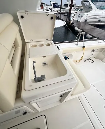 First Light II Yacht Photos Pics 1998 Tiara Yachts 3500 Open boat sink and seating area at marina.