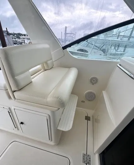 First Light II Yacht Photos Pics 1998 Tiara Yachts 3500 Open interior with white seating and storage.