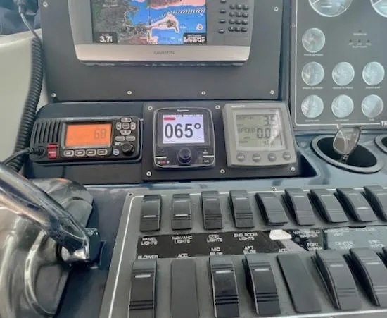 First Light II Yacht Photos Pics Control panel of a 1998 Tiara Yachts 3500 Open with navigation instruments.