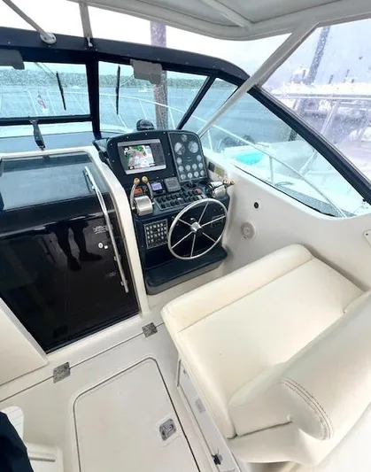 First Light II Yacht Photos Pics 1998 Tiara Yachts 3500 Open helm with modern navigation equipment and comfortable seating.