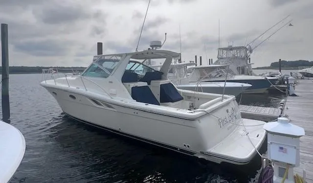 First Light II Yacht Photos Pics 1998 Tiara Yachts 3500 Open docked at marina, overcast sky.