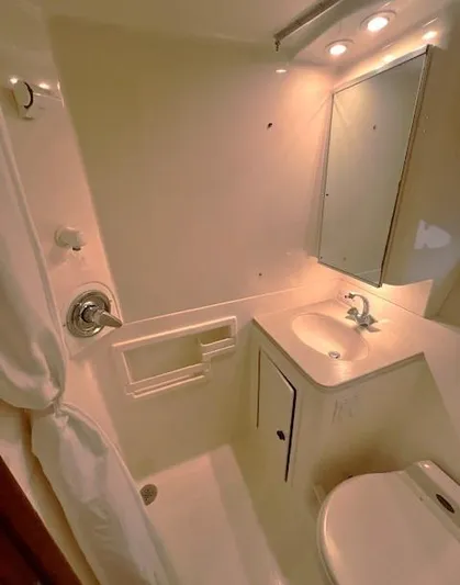First Light II Yacht Photos Pics 1998 Tiara Yachts 3500 Open bathroom with shower, sink, and toilet.