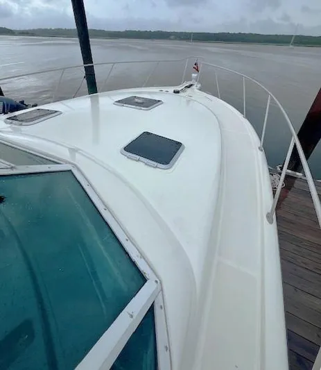 First Light II Yacht Photos Pics 1998 Tiara Yachts 3500 Open on a docked waterfront view.