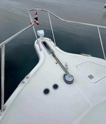 First Light II Yacht Photos Pics 1998 Tiara Yachts 3500 Open bow with anchor chain and flag.