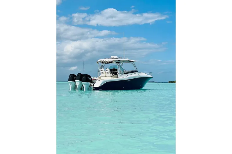  Yacht Photos Pics 2007 Hydra-Sports Vector 3300 VX boat on clear turquoise water under blue sky.