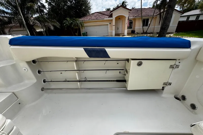  Yacht Photos Pics 2007 Hydra-Sports Vector 3300 VX boat interior with rod storage and blue cushioned seating.